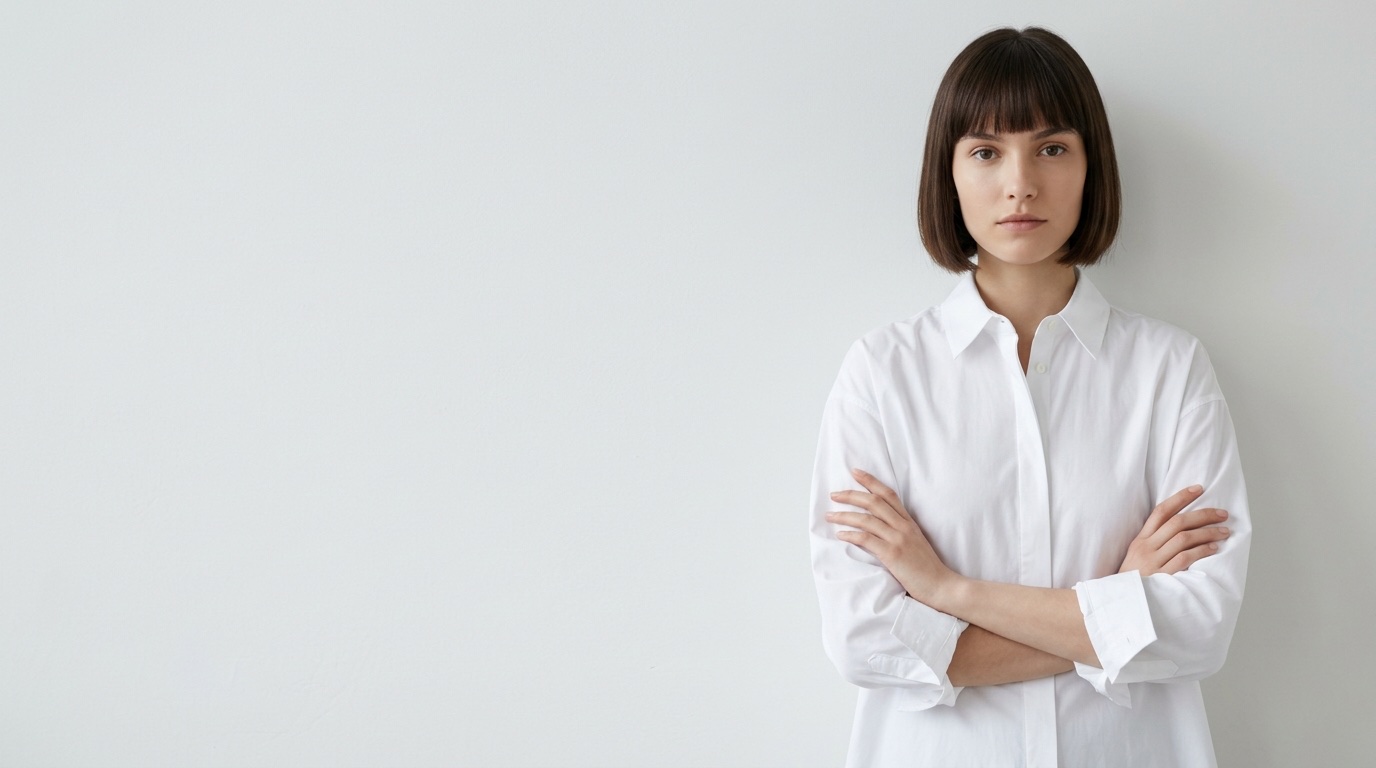 Model with a dark bob in a white shirt